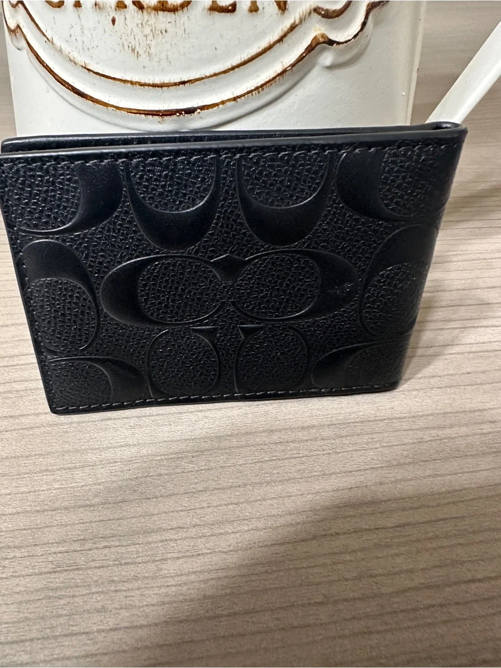 Coach embossed signature